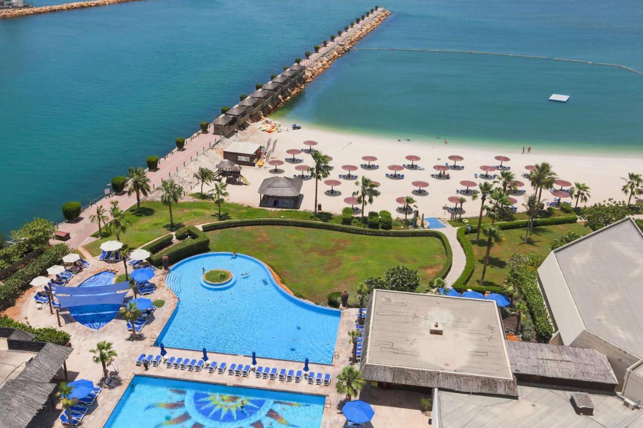 Radisson Blu Resort, Sharjah Bagian luar foto The beach at Jumeirah Beach Hotel